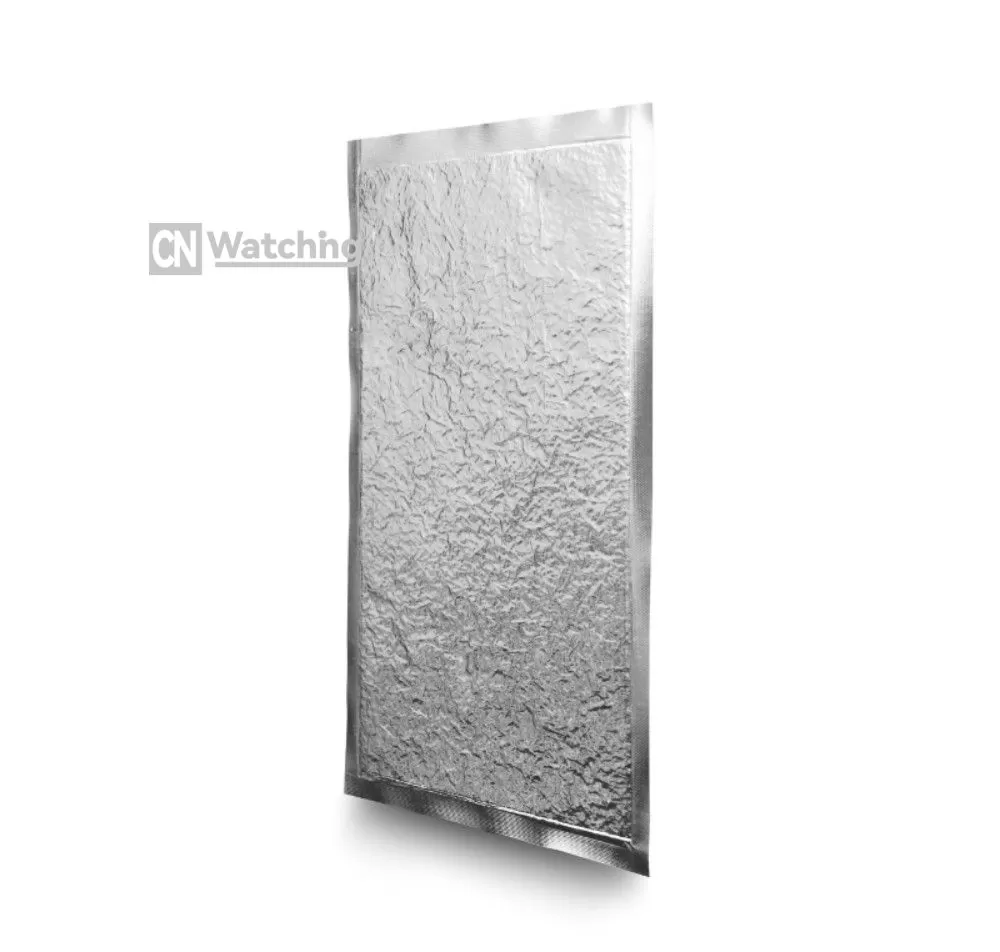 A finished Vacu-Slim ultra-thin VIP panel featuring complex, high-precision die-cut holes and notches based on custom CAD drawings for electronic components.